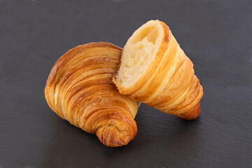 Croissant on black stone board
