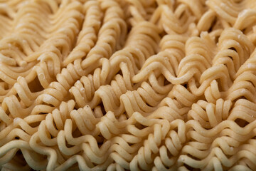 Background with uncooked instant noodles