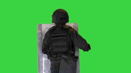 Riot police unit making sound hitting shield with baton on a Green Screen, Chroma Key.