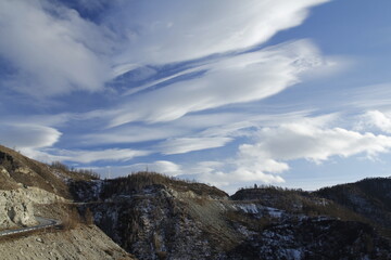 Учзкуыышму clouds and blue sky over the mountain