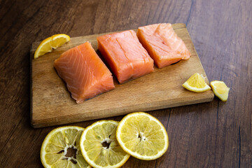 Raw salmon fish fillet with lemon