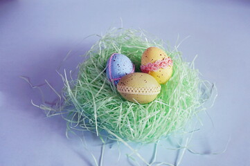 Decorated Colored Eggs on Easter Grass