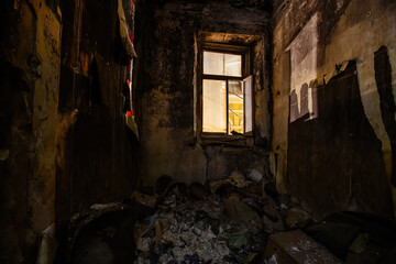 Fototapeta na wymiar Burnt house interior. Consequences of fire concept