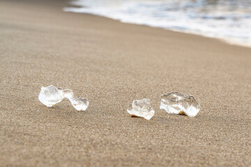 Fototapeta na wymiar Pieces of ice one the beach, Sobieszewska Island Baltic See