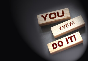 YOU CAN DO IT word on wooden blocks on gray background. Motivation affirmation encouraging words...