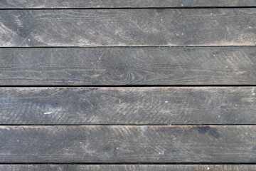 old dusty gray wooden plank wall. horizontal lines. rough surface texture