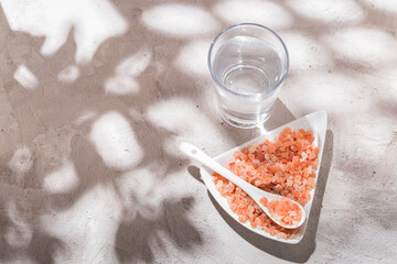 pink himalayan salt, in bowl on white background