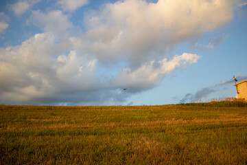 Obraz premium blue sky and clouds over earthen dam