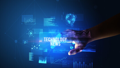 Hand touching TECHNOLOGY NEWS inscription, new business technology concept