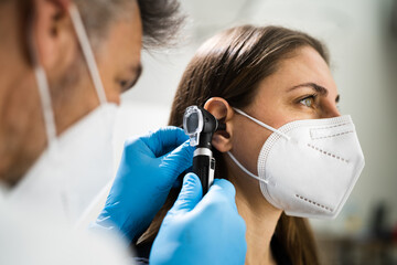 Otolaryngology Doctor Examining Patient Ear
