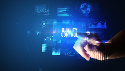 Fototapeta premium Hand touching QUALITY CONTROL inscription, new business technology concept