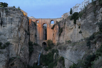 Guadalevín River and waterfall at sunset, Puente Nuevo, El Tajo Gorge, Ronda, Málaga, Andalusia,...