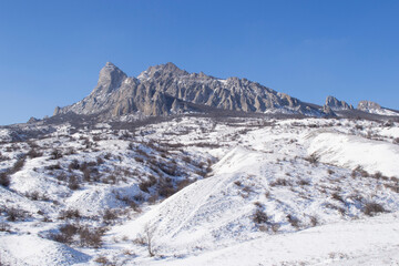 Winter landscape in the Crimea. View of the snow-covered mount Suryu Kaya of the Karadag Nature Reserve.