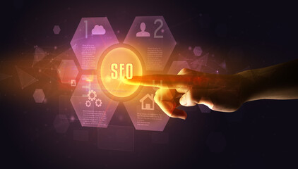 Hand touching SEO inscription, new technology concept