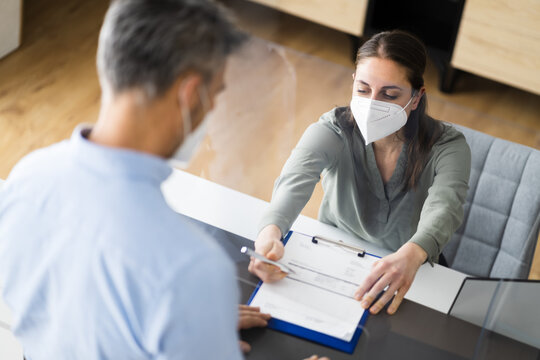 Hotel Reception Desk Protected By Medical Mask