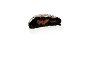 Fototapeta premium a half piece of cookie stuffed with melted chocolate, homemade side view 