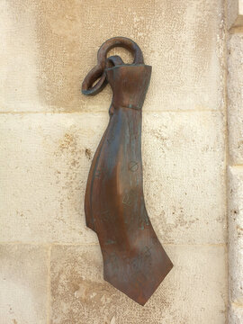 Fototapeta Metal sculpture of men's tie on the building wall in old town of Zadar. Croatians invented the tie
