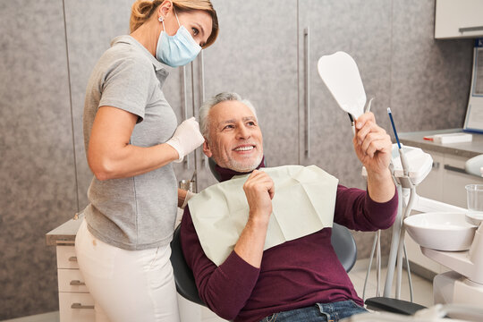 Handsome Old Man Talking To The Dentist