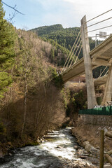 hanging viaduct between rocky mountains over the rapids river in the pyrenees