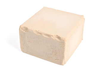 Fresh Pressed (Compressed) Bakers Yeast Cube. Isolated on White.