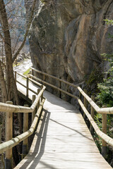 trail between rocks with impregnated pine wood barriers