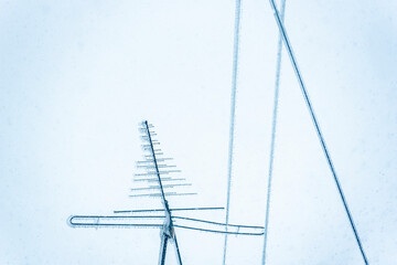 Electricity wires and antenna covered with ice