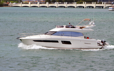 Motor yacht cruising on Biscayne Bay off of Miami Beach,Florida