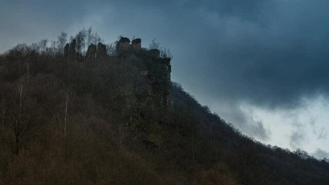 Medieval fortress silhouette on a stormy weather. Time lapse. No birds. This medieval fortress was the source of inspiration for the novel "The Carpathian Castle" by french author, Jules Verne.