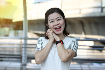 Portrait of a cheerful beautiful woman happy and smiling .
