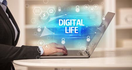 DIGITAL LIFE inscription on laptop, internet security and data protection concept, blockchain and cybersecurity