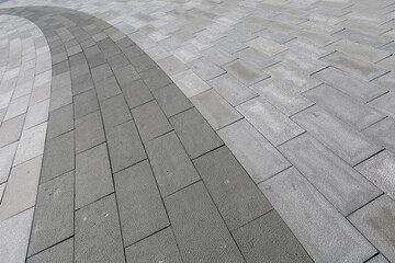 Roads paved with grey floor tiles