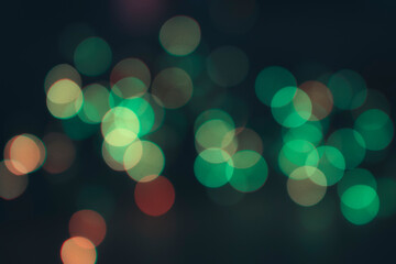 Muted green bokeh effect on black background © Kate Cneazeva