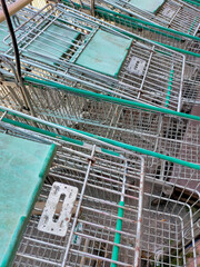 Selective focus. Some shopping carts are arranged outside the supermarket area.Shot were noise and artifacts.