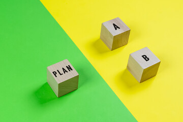 Wooden block with word PLAN A and PLAN B.