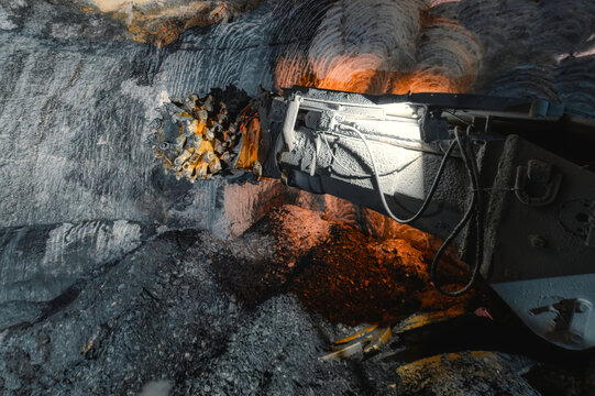 Drilling head of a mine roadheader. Underground mining of ore deposits