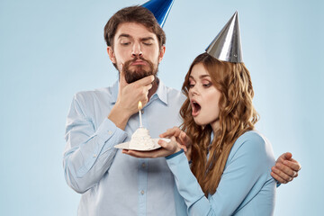 Party man and woman birthday cake corporate fun blue background