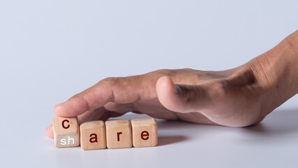 hand holding dice with text for illustration of "care and share" words 