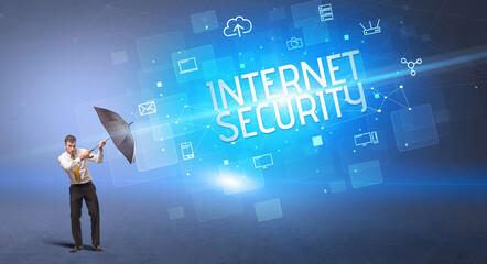 Businessman defending with umbrella from cyber attack and INTERNET SECURITY inscription, online security concept