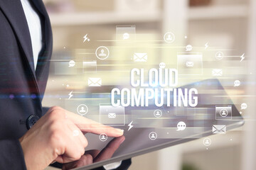 Close-up of a tablet searching CLOUD COMPUTING inscription, modern technology concept