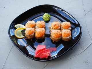 Japanese kitchen. Sushi and rolls on gray concrete background