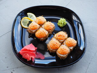 Japanese kitchen. Sushi and rolls on gray concrete background