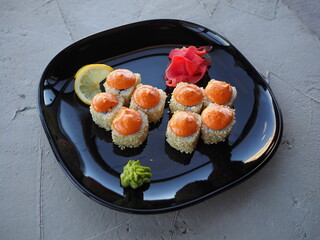 Japanese kitchen. Sushi and rolls on gray concrete background
