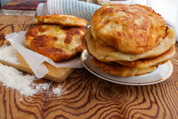 homemade cheese pies are on the kitchen table