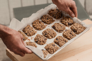 Homemade healthy cookies on the baking tray, close up, from above - 415514265