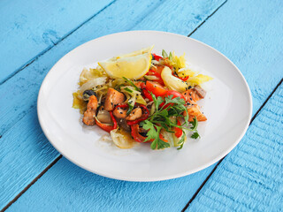 Chicken salad on blue wooden background