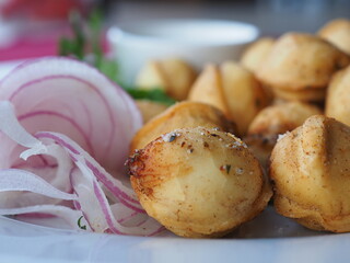 Fried dumplings with dill in a plate