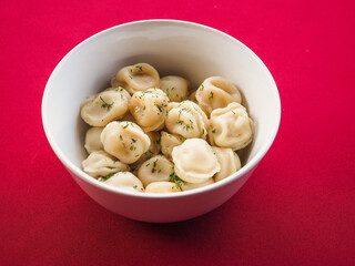 Fried dumplings with dill in a plate