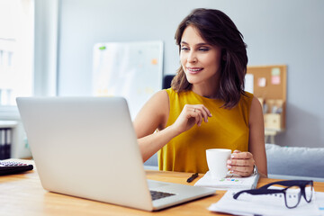 Beautiful young woman working from home office