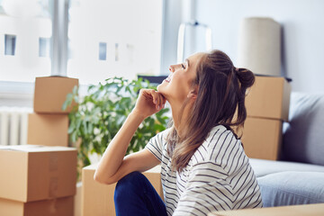 Young woman celebrates moving into a new apartment