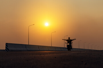 Young man riding big bike motocycle on asphalt high way against, Motorbike man has freedom